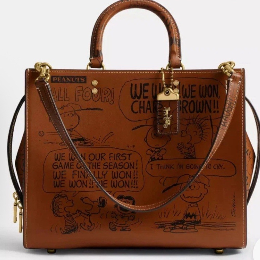 SOLD COACH x PEANUTS LTD HAZELNUT NEWSPRINT SNOOPY ROGUE
